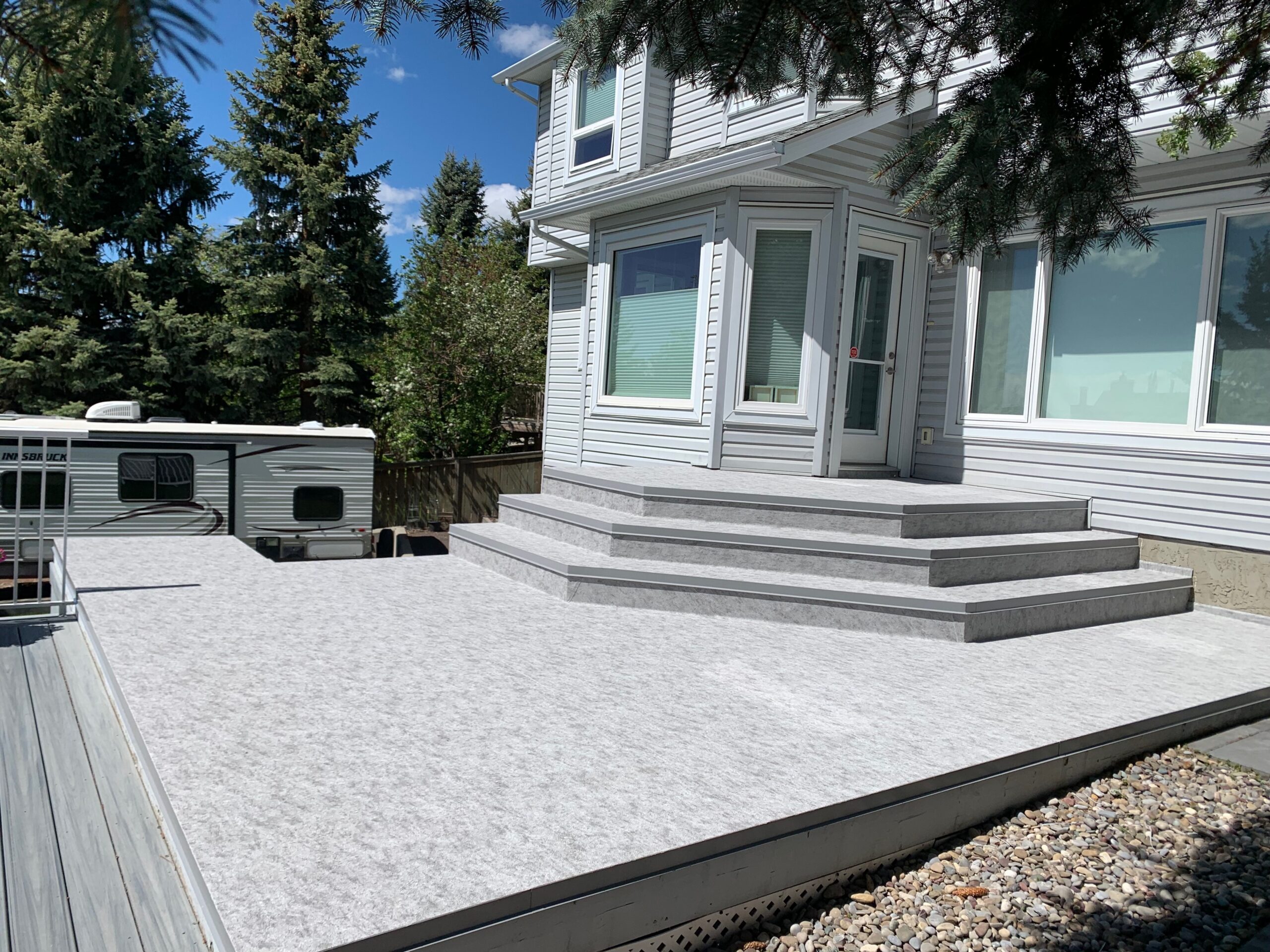 Slate grey Tufdek vinyl deck surface on completed project