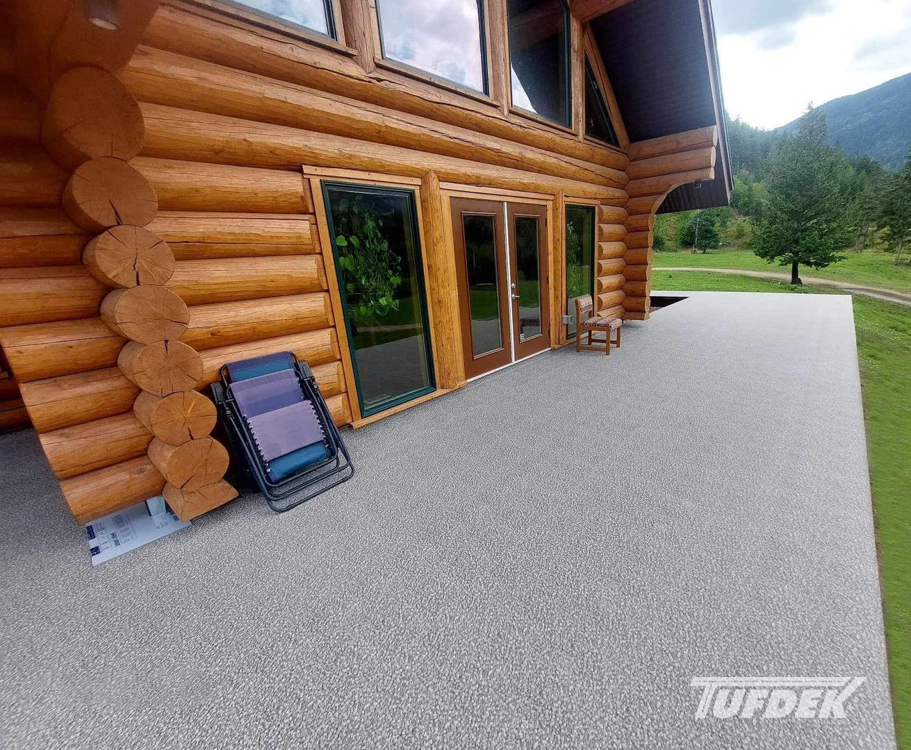 Completed residential deck project with finished vinyl surface